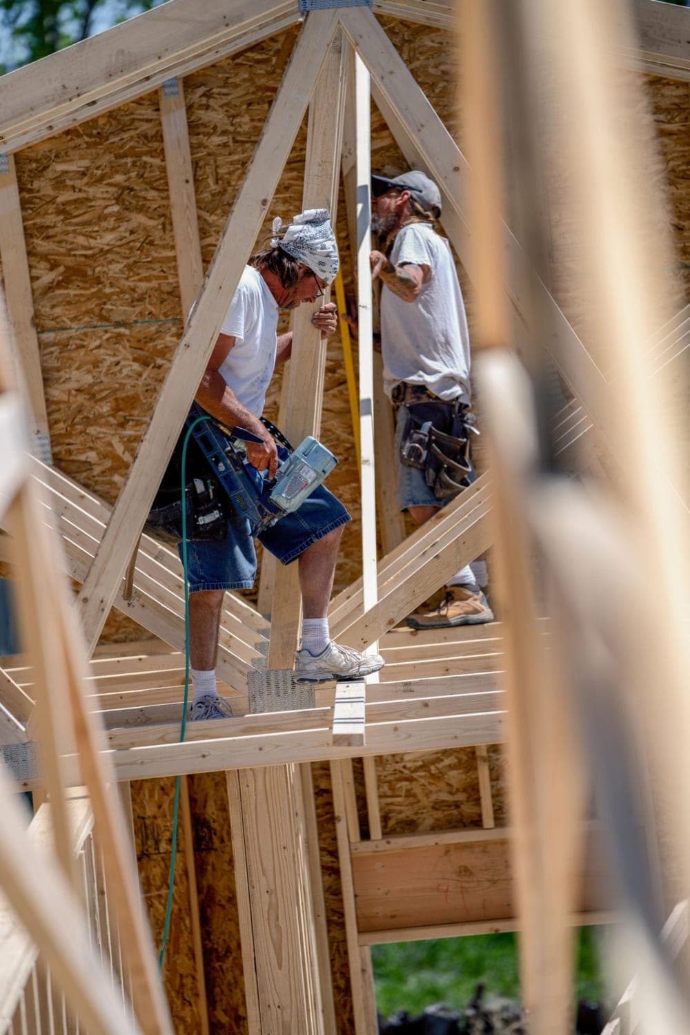Timber and Testament crew members framing a residential structure